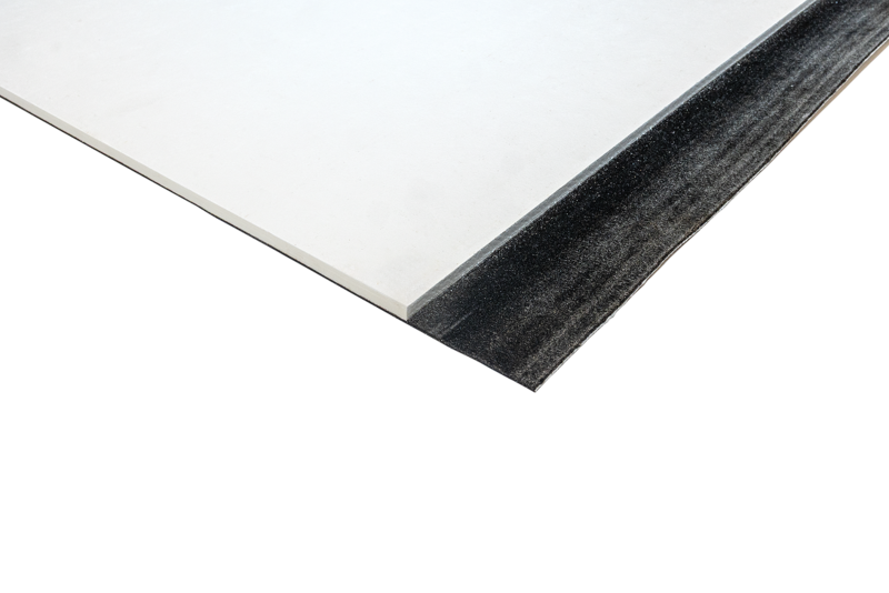 Close-up studio shot of a rigid white construction panel featuring a black self-adhesive or rubberized edge strip along one side.